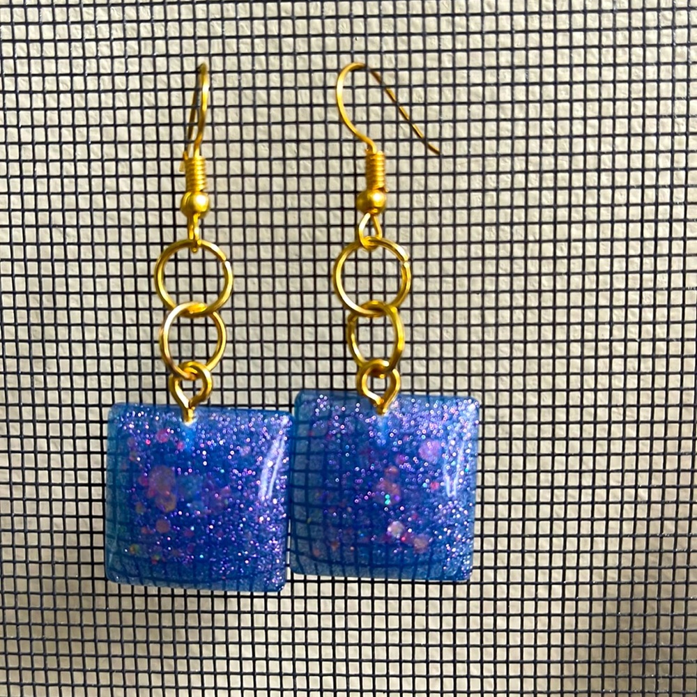 Handmade by me! Sparkly and dangly, purple blue resin earrings.